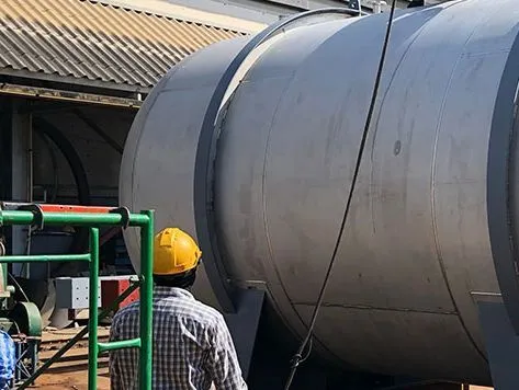 Metlab engineer conducting an inspection of a large storage vessel
